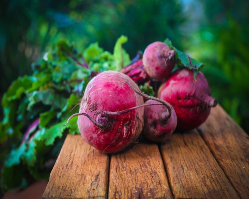 Fresh fruits and vegetables on a rustic table representing healthy nutrition